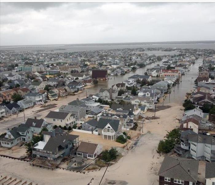 overhead view of shore town covered in sand and water